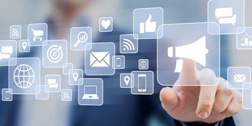 Finger pointing to apps on a screen.
