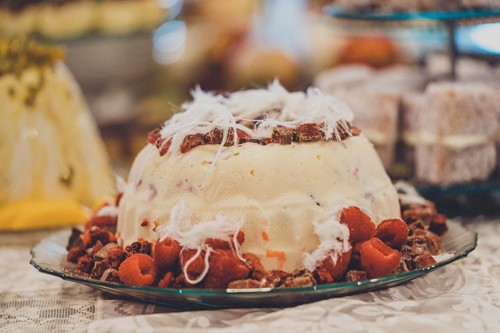 Pudding surrounded by strawberries.