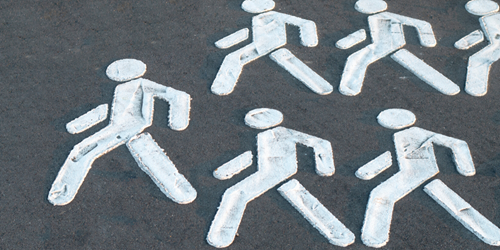Pavement with chalk people drawn on.