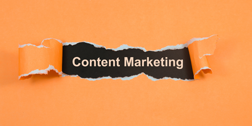 Ripped paper with 'Content marketing' revealed.