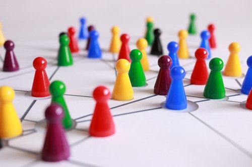 Multi coloured pin points connected by black line.